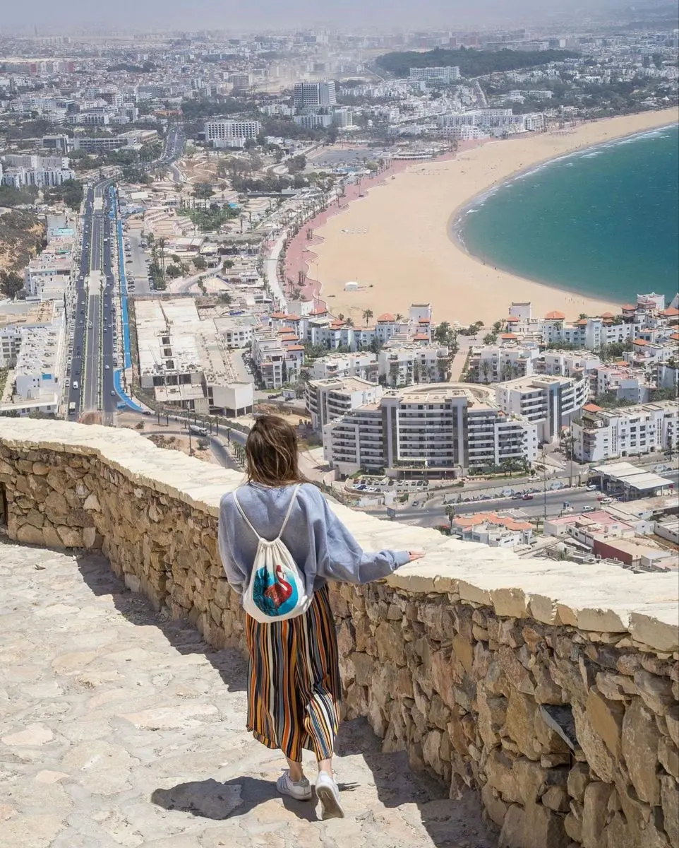 Traveler overlooking Agadir bay from the Kasbah